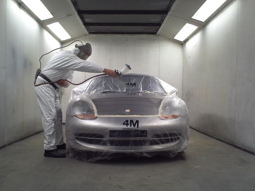 Porsche Boxster recieving its final coat of paint prior to baking in our professional low bake oven